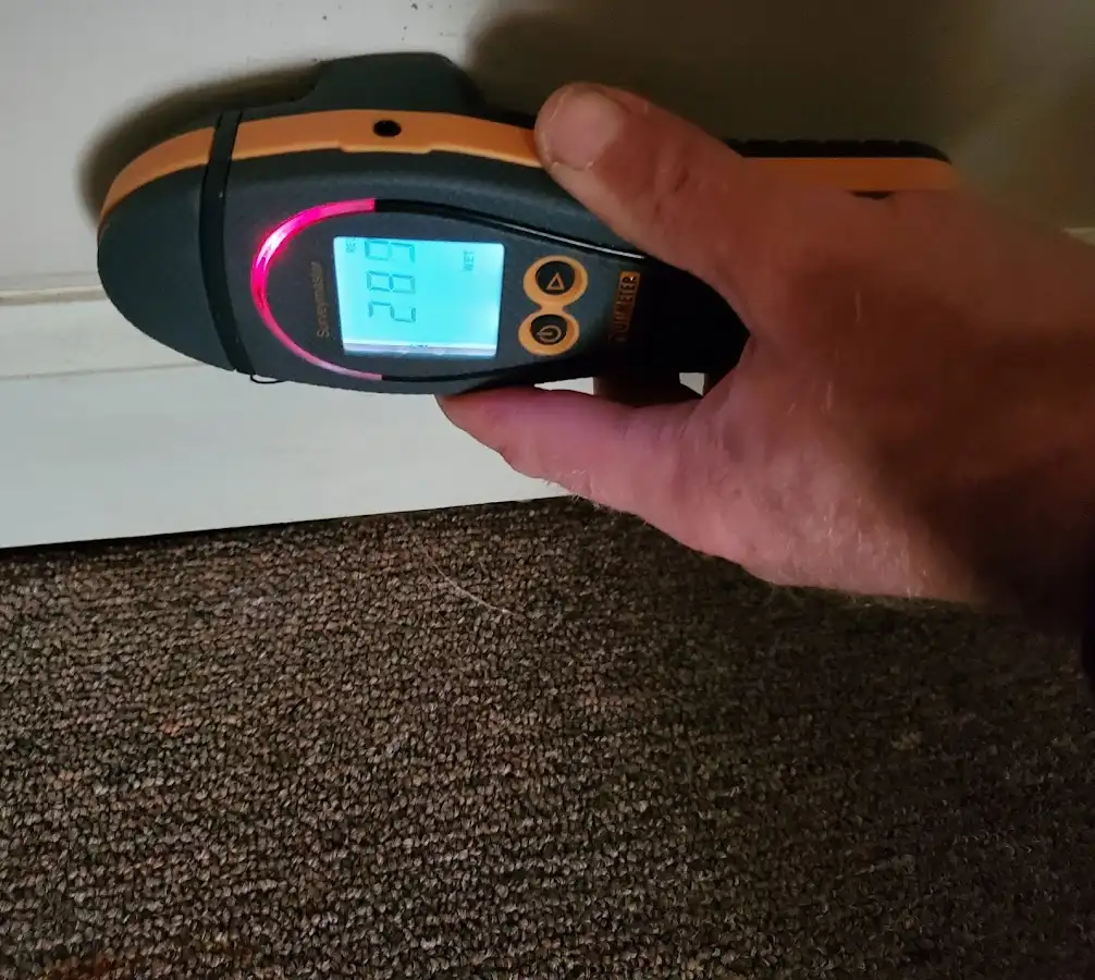 Moisture detection at baseboard during Storm Damage Restoration in Savannah